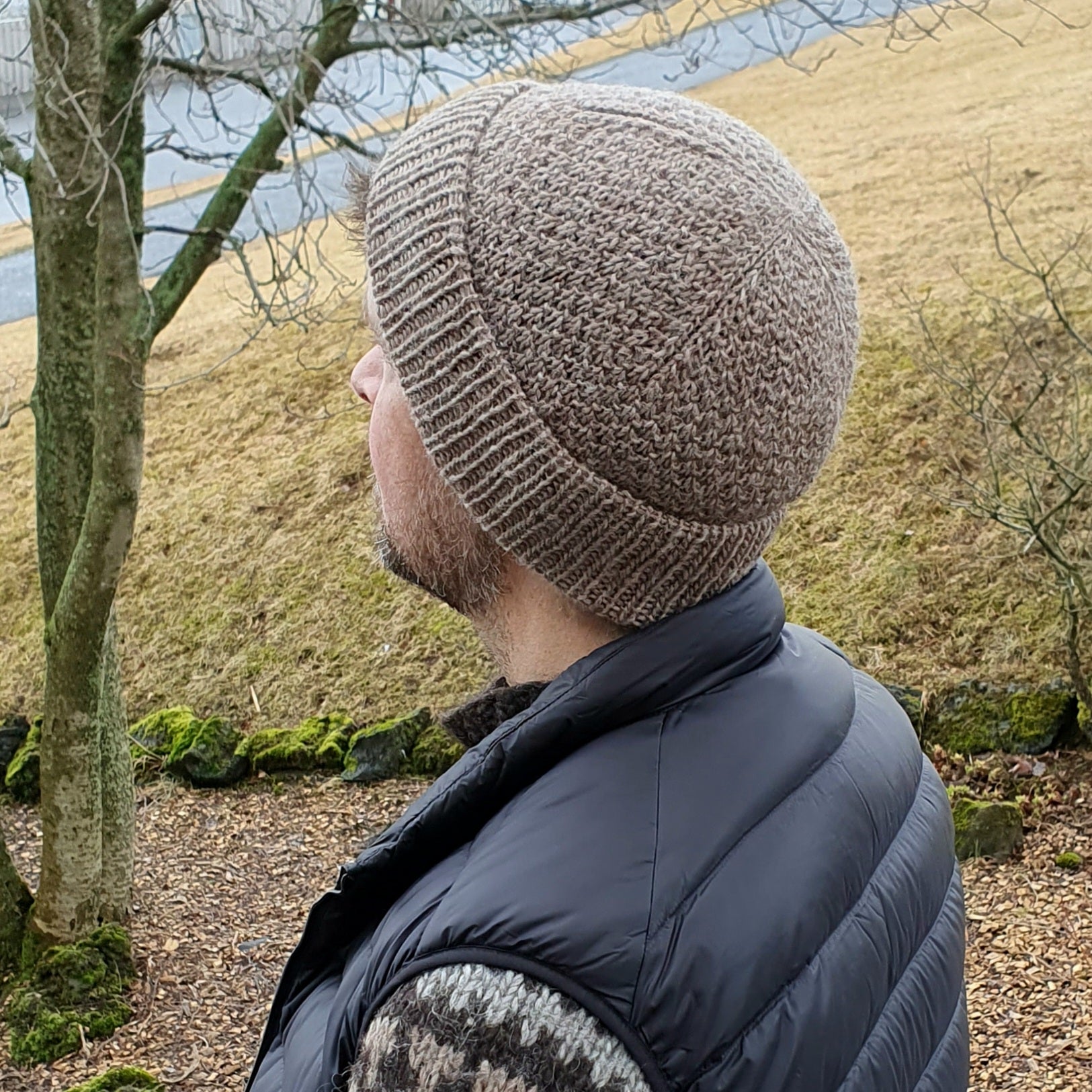 Nordic fisherman style texture knit beanie in brown wool worn by a man