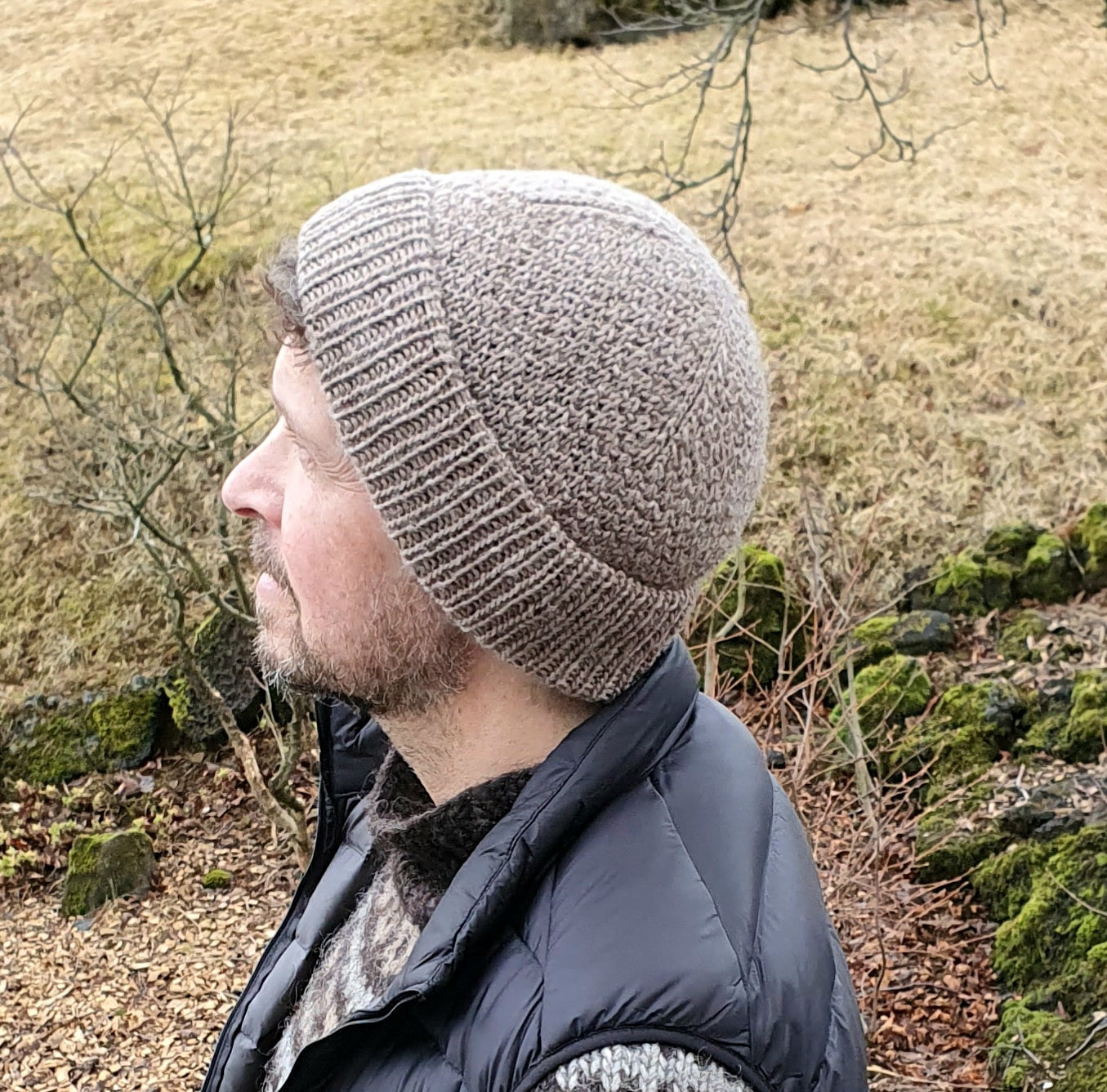 Nordic fisherman style texture knit beanie in brown wool worn by a man