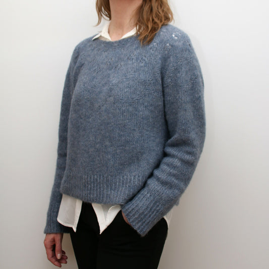 Side view of the Embla Sweater showing relaxed fit and elegant neckline